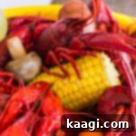 close up of crawfish with corn and mushroom and carrots