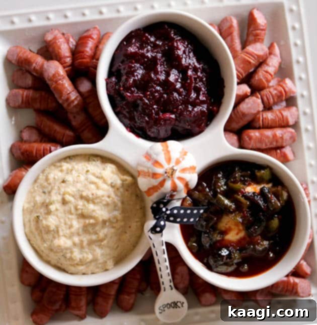 Halloween-themed appetizer featuring 'dead man's fingers' made from lil' smokies and dipping sauces.