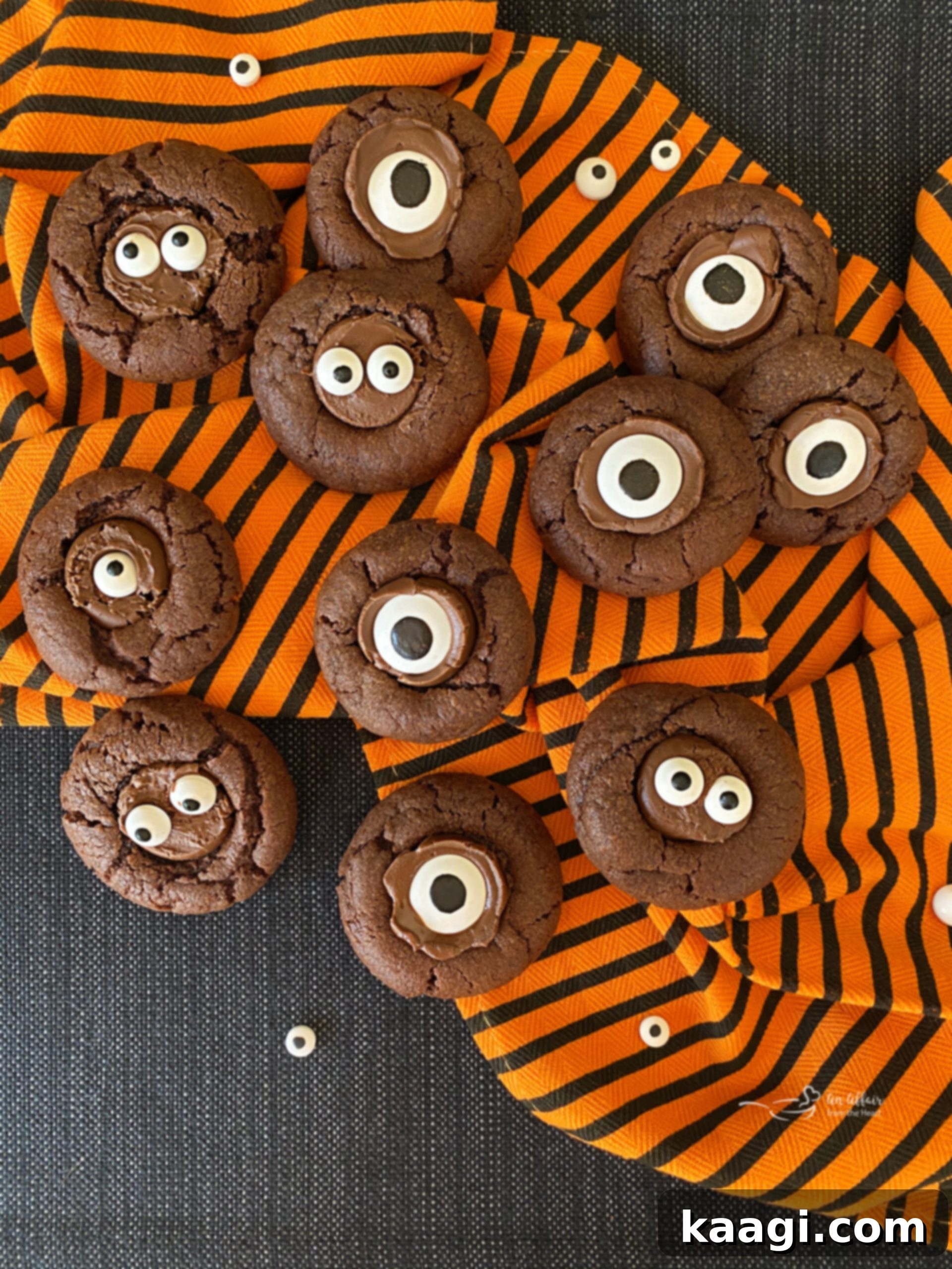 Halloween chocolate sugar cookies with candy eyeballs.