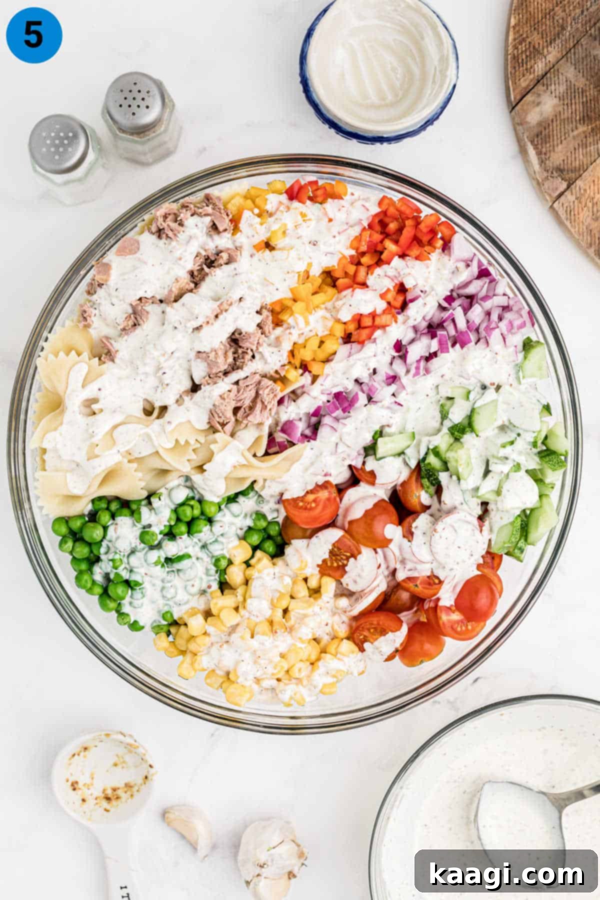 Creamy Tuna Pasta Salad 5 a large mixing bowl filled with all the tuna pasta salad ingredients before the dressing is added