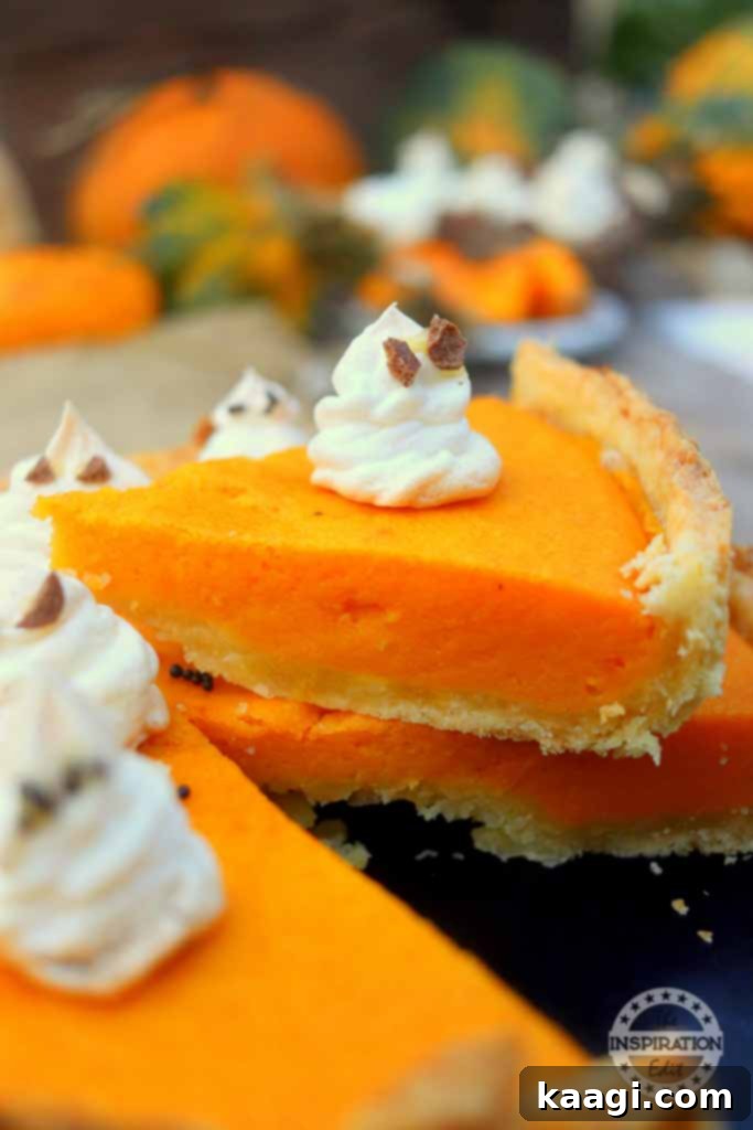 A comforting pumpkin pie topped with a single, charming ghost figure made from pastry.