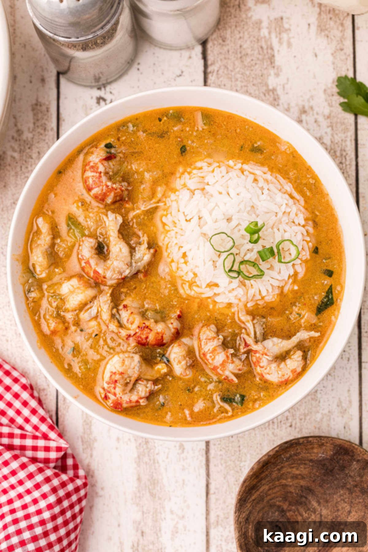 delicious bowl of crawfish etouffee with a scoop of rice on top