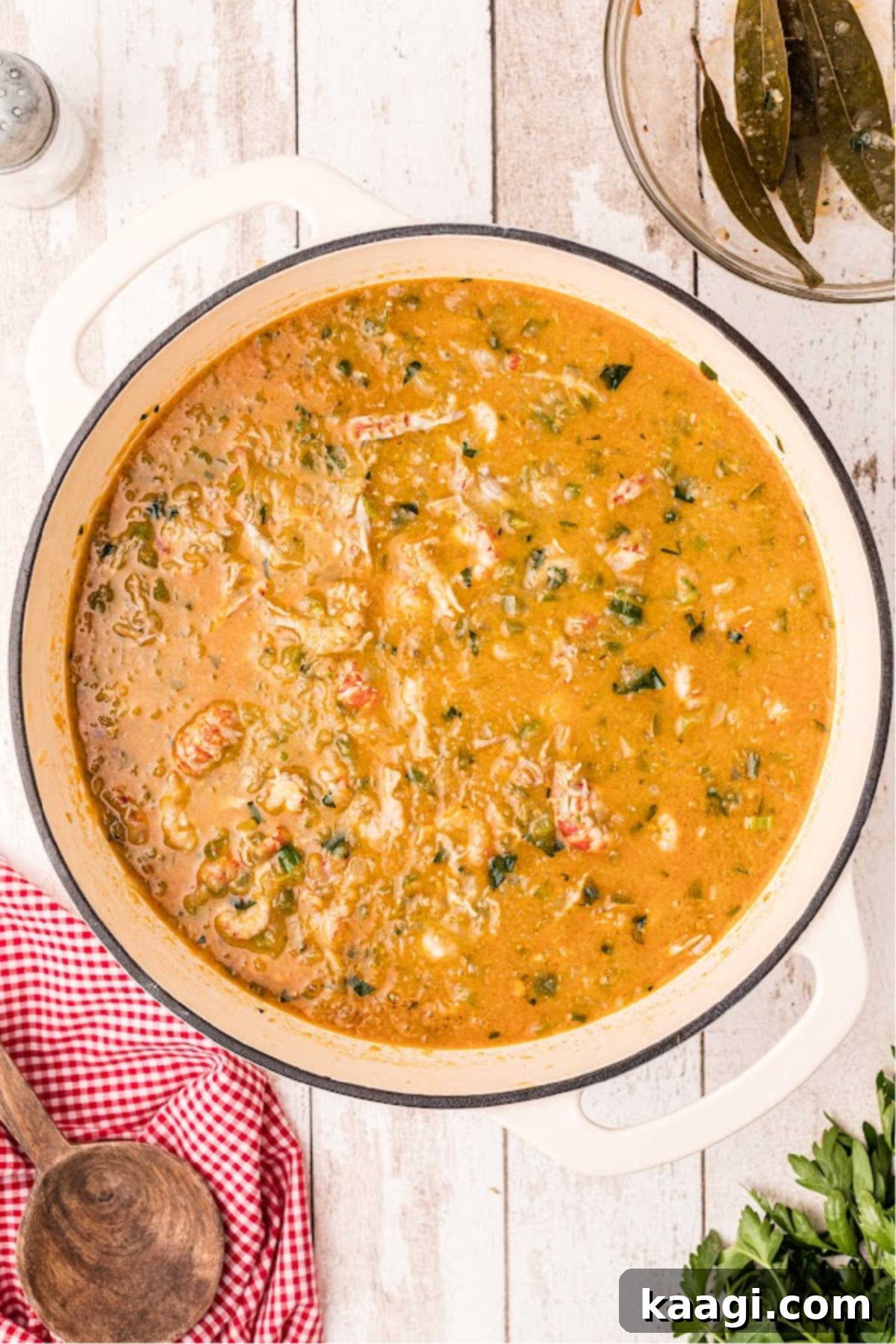 A large Dutch oven filled with Crawfish Etouffee.