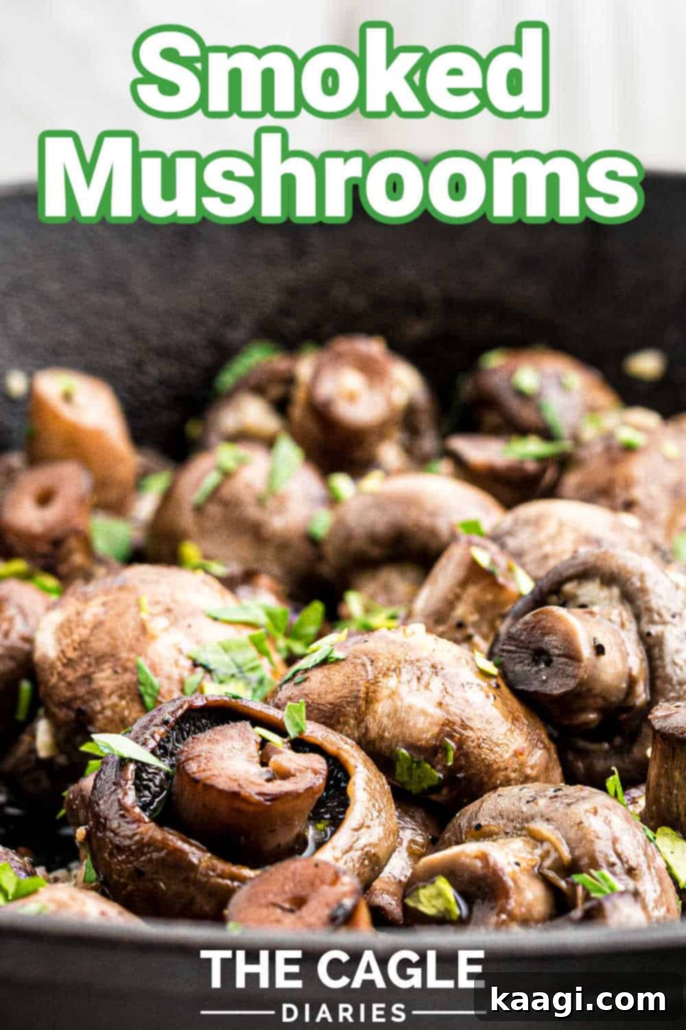 Wood-Kissed Mushrooms 6 Close up of a cast iron pan full of smoked mushrooms sprinkled with parsley, with a text overlay for Pinterest sharing.