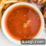 Bold Cajun Butter Glaze 5 close up of a bowl of cajun butter sauce.