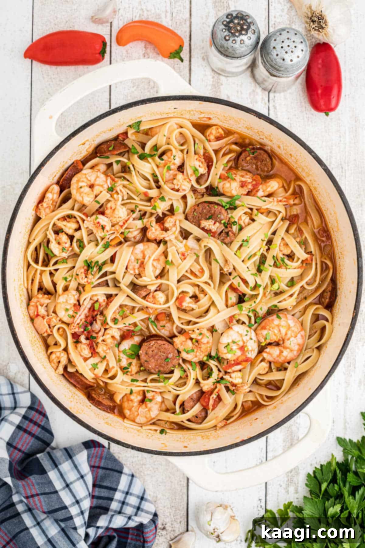 An overhead shot of a pot of crawfish pastalaya, showcasing its rich colors and abundance of seafood and pasta.