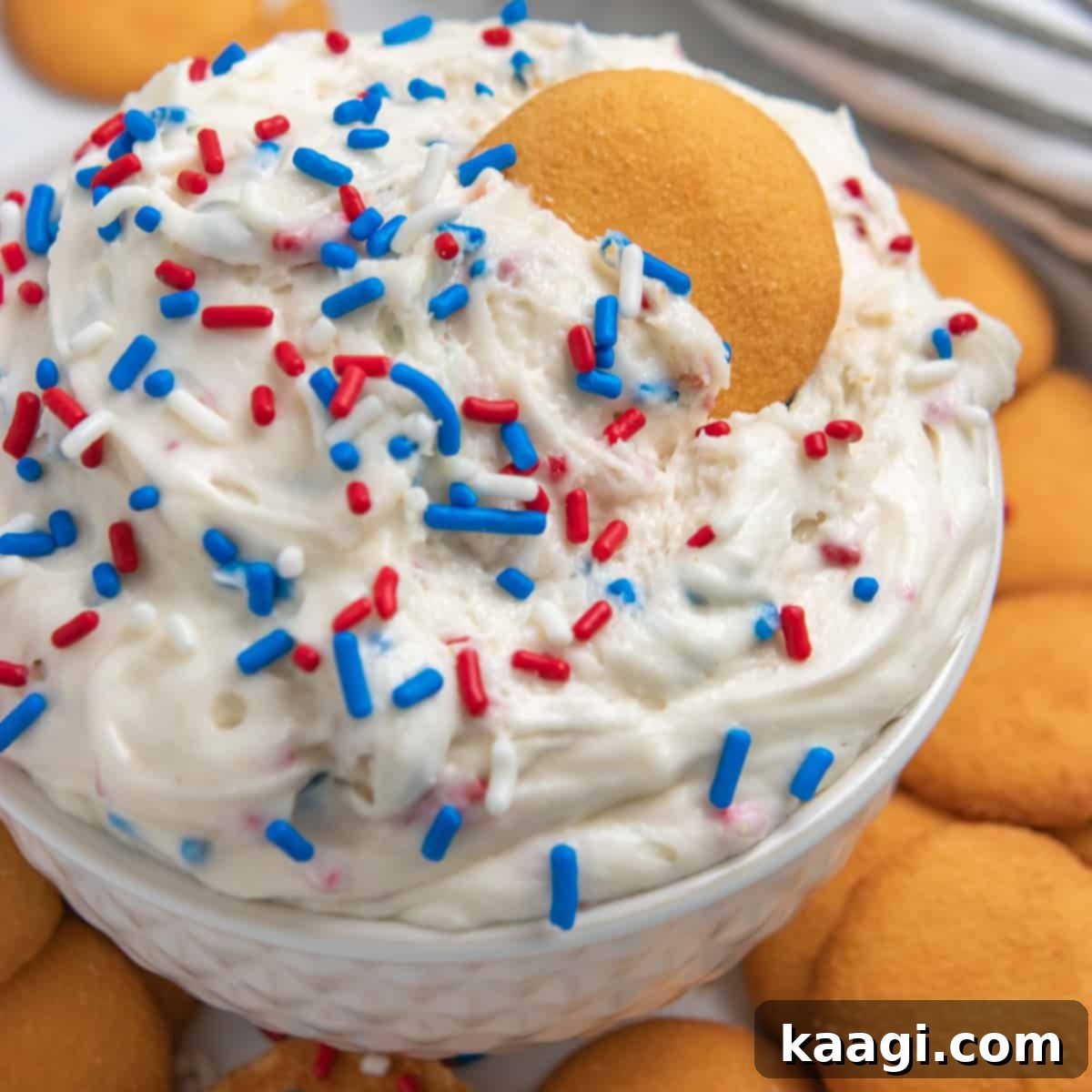 Red, White and Blue Funfetti Dip (No Bake!) served with graham crackers, vanilla wafers, and pretzels for dipping.