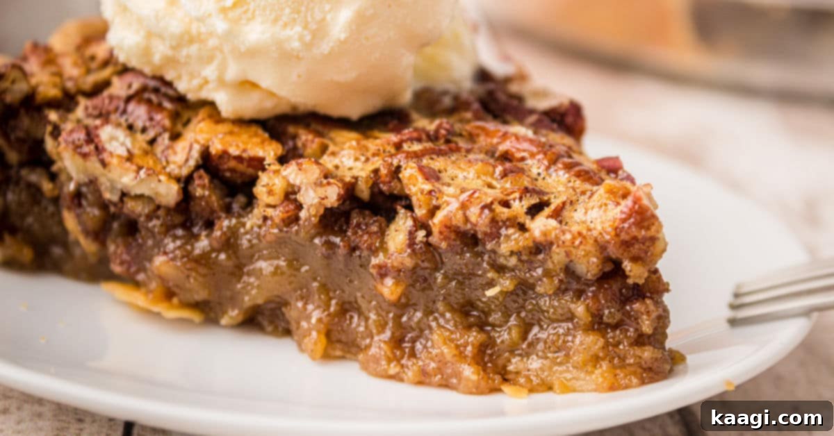 Close up of a slice of old fashioned pecan pie with a scoop of vanilla ice cream on top, highlighting the sticky pecan filling and flaky crust.