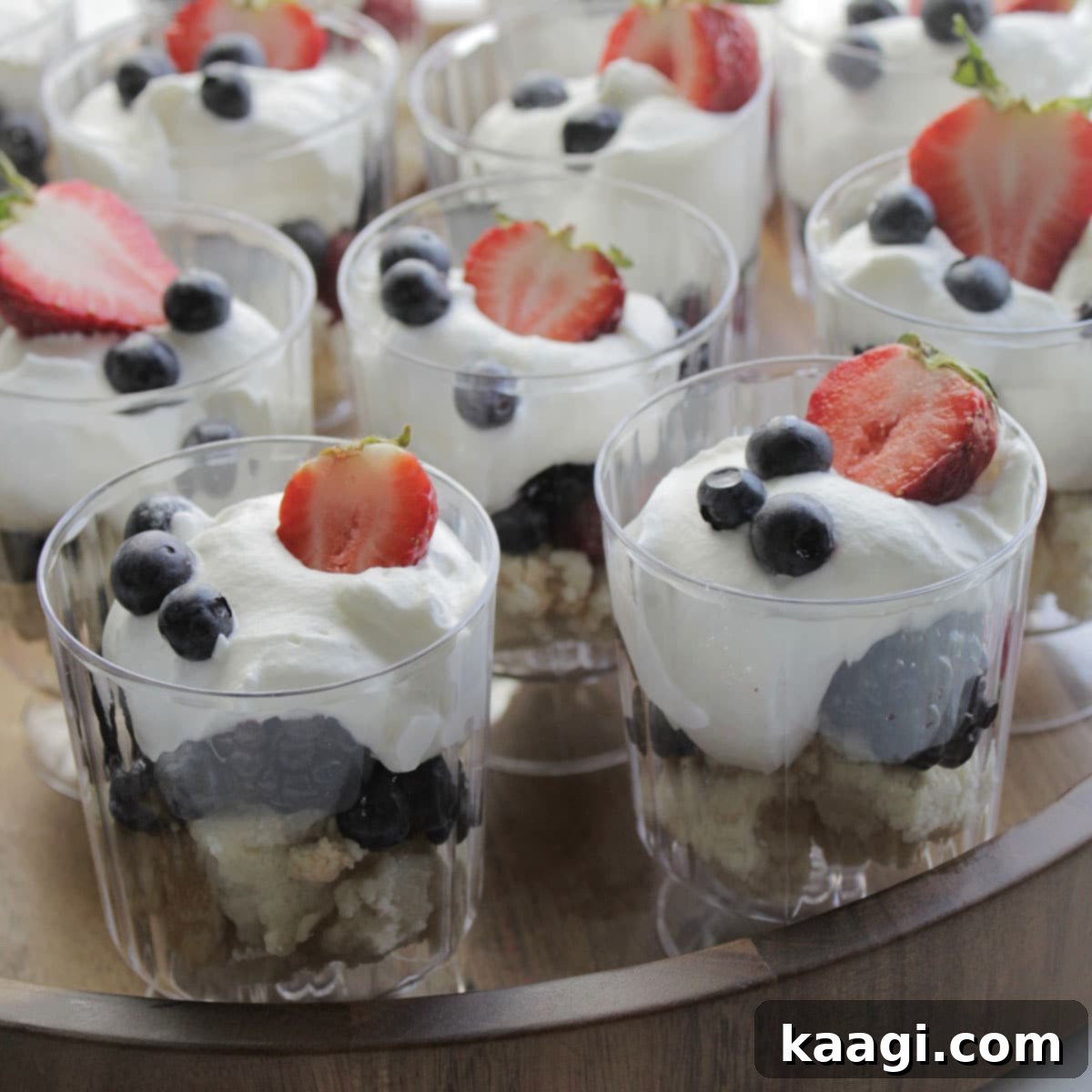 Individual Angel Food Cake Dessert Cups (No Bake) layered with fresh berries and whipped cream.