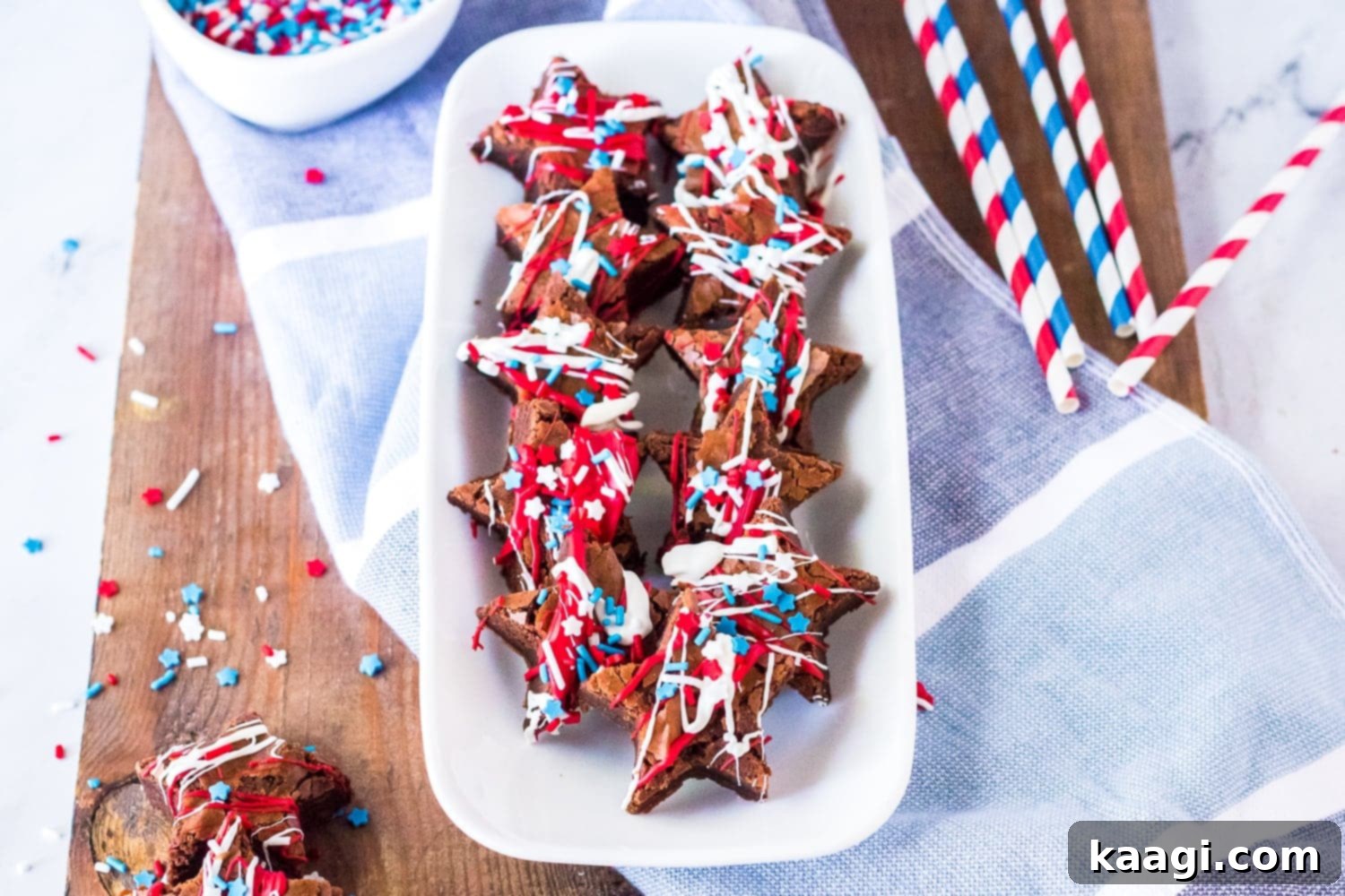 Fun, festive Patriotic Brownies cut into star shapes and drizzled with chocolate and patriotic sprinkles.