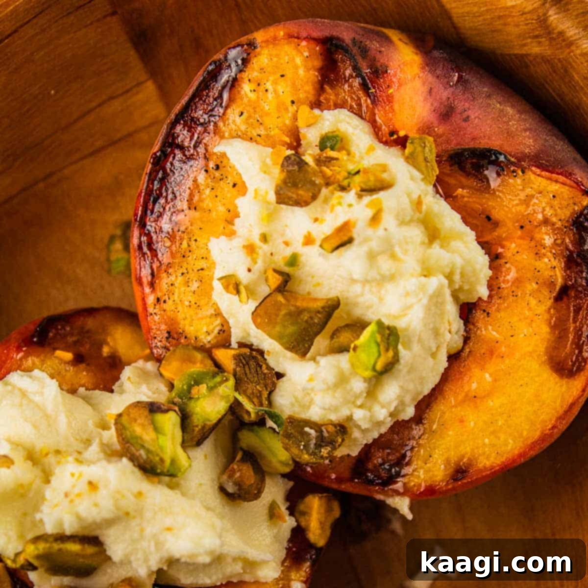 FRESH Grilled Peaches with Mascarpone and Pistachios, elegantly plated.