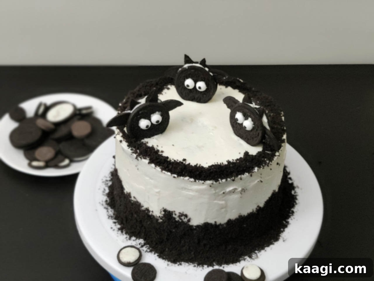 Vanilla Oreo Cake Recipe decorated with Oreo bats, perfect for Halloween.
