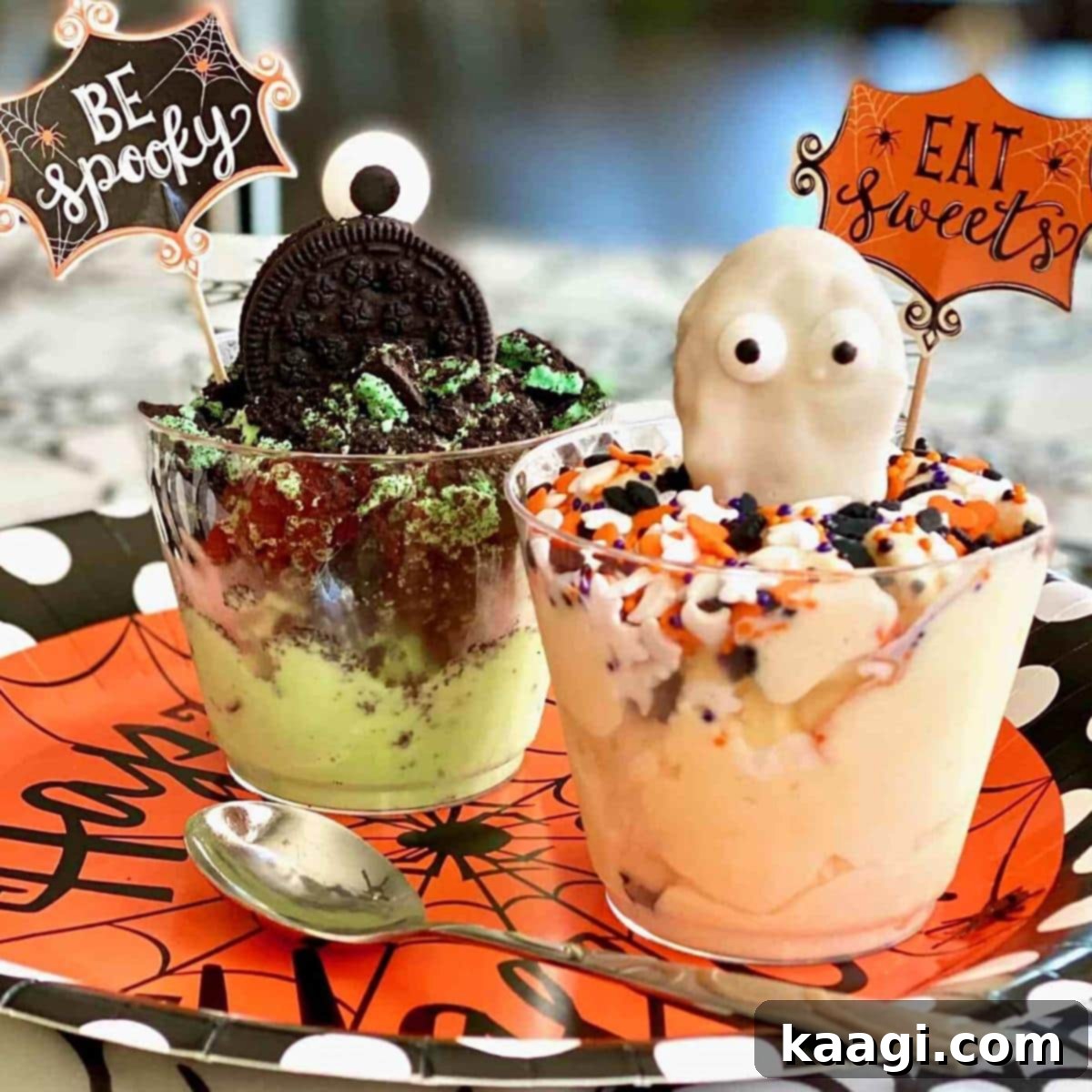 Festive Halloween Ice Cream Cups decorated with Oreo and Nutter Butter cookies.