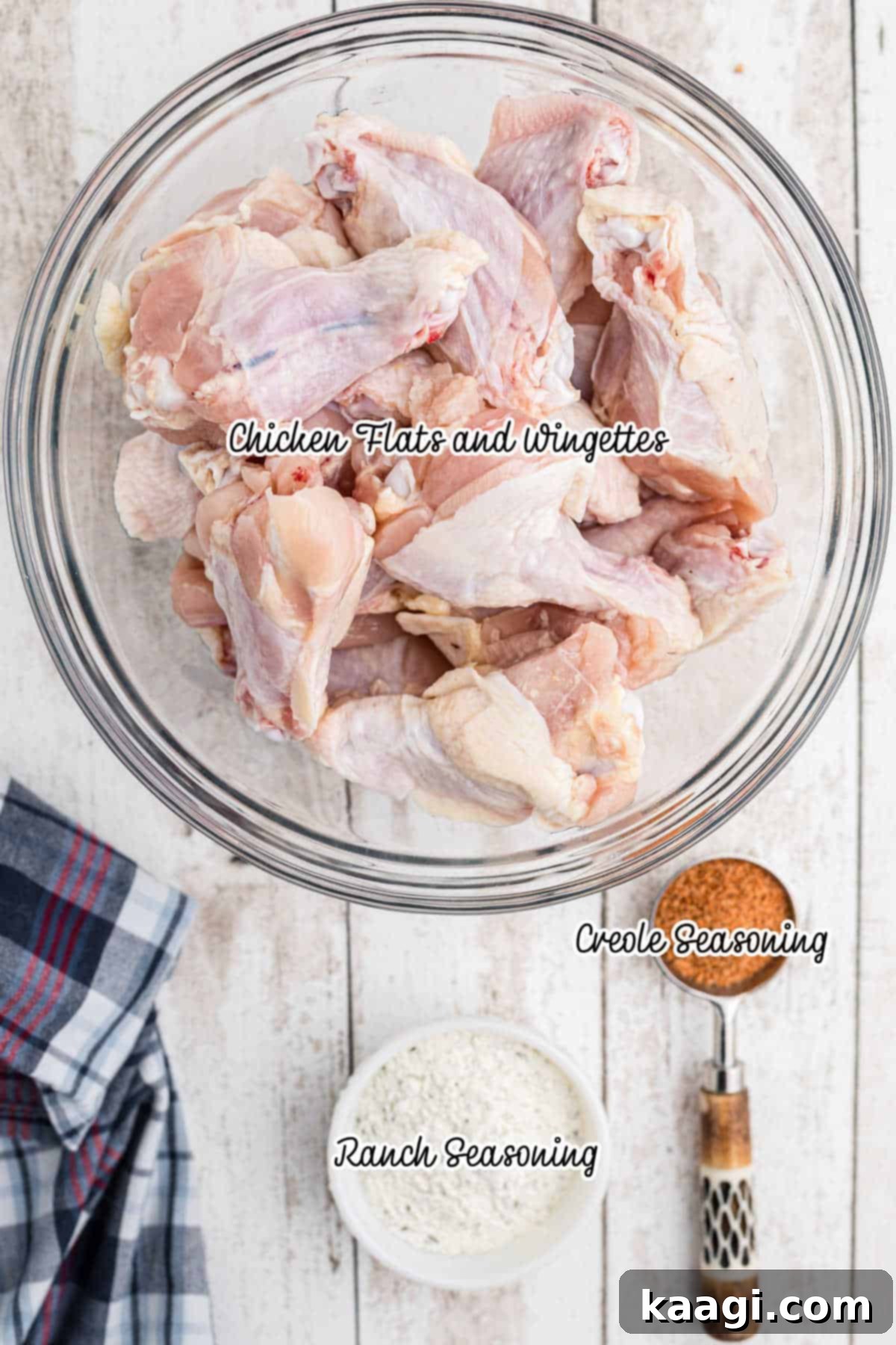 Crispy Air Fryer Ranch Wings 3 A bowl of fresh chicken flats and wingettes with some ranch seasoning and creole seasoning, ready for preparation.