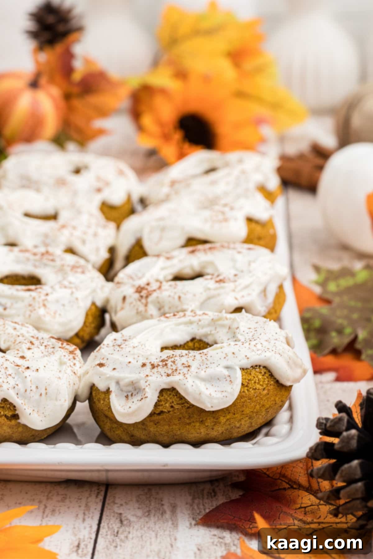 Close up of a plate full of pumpkin spice donuts.
