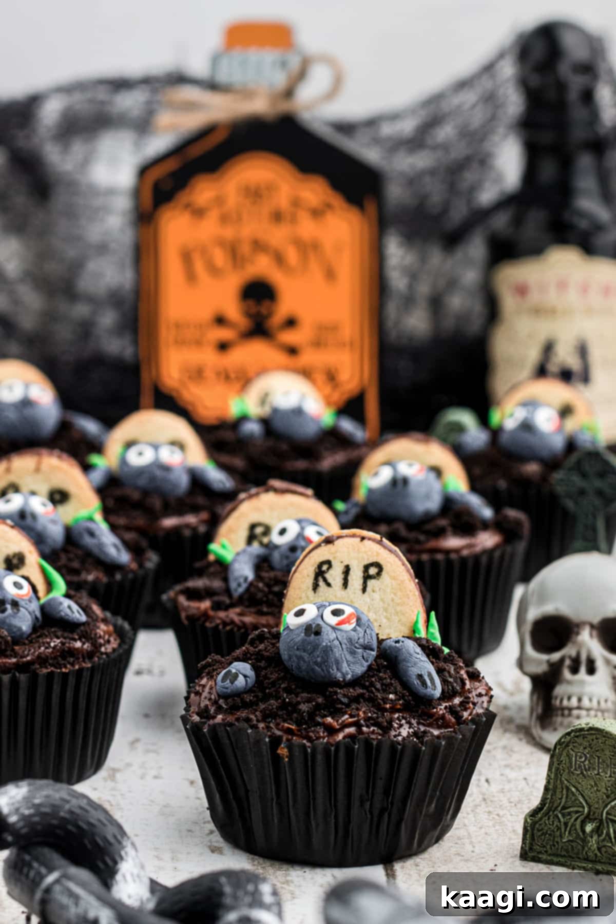 Halloween Party Zombie Cupcakes Display A table spread with many delicious and spooky zombie cupcakes, ready for a Halloween party.