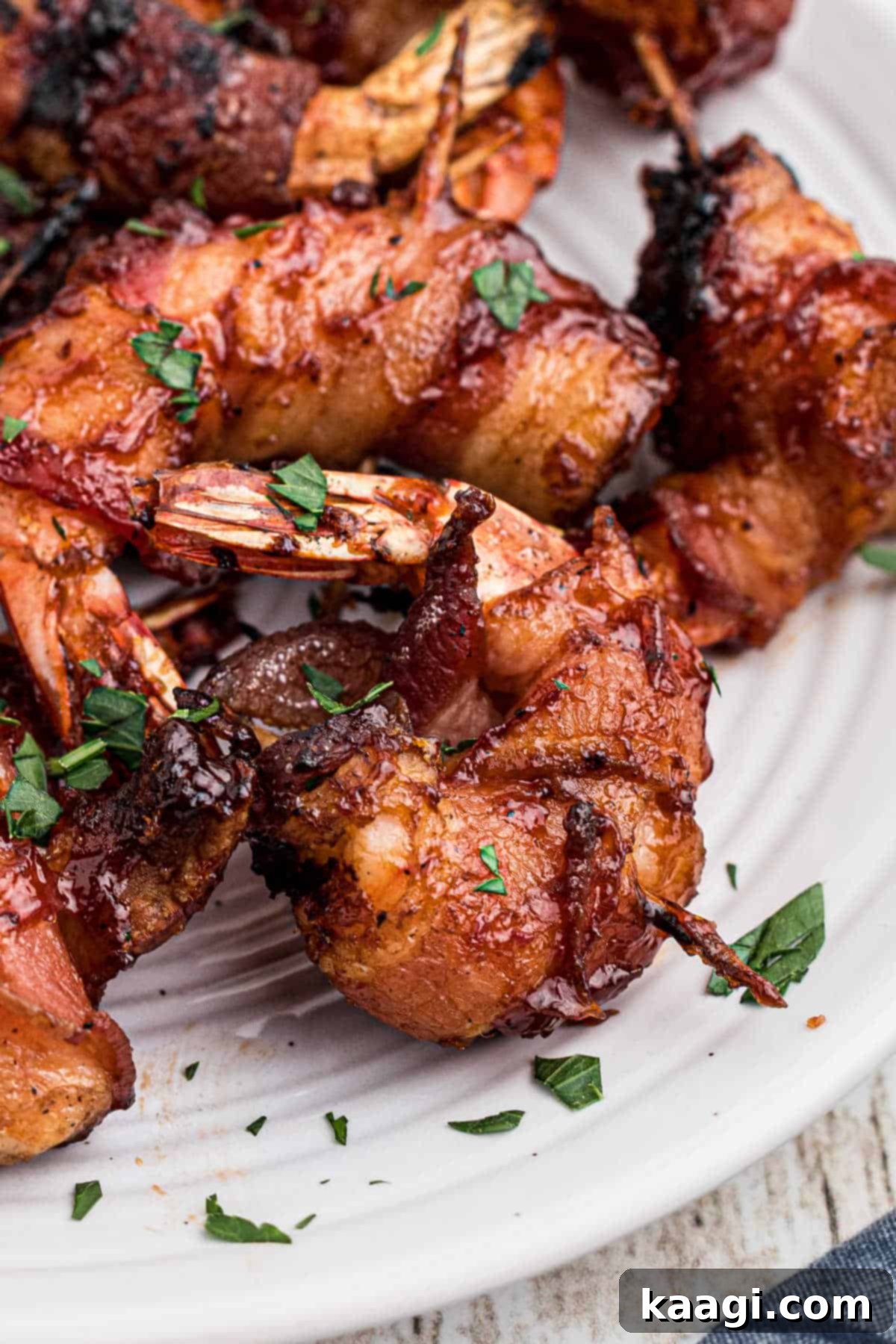 Close-up of perfectly smoked bacon wrapped shrimp with a golden crisp