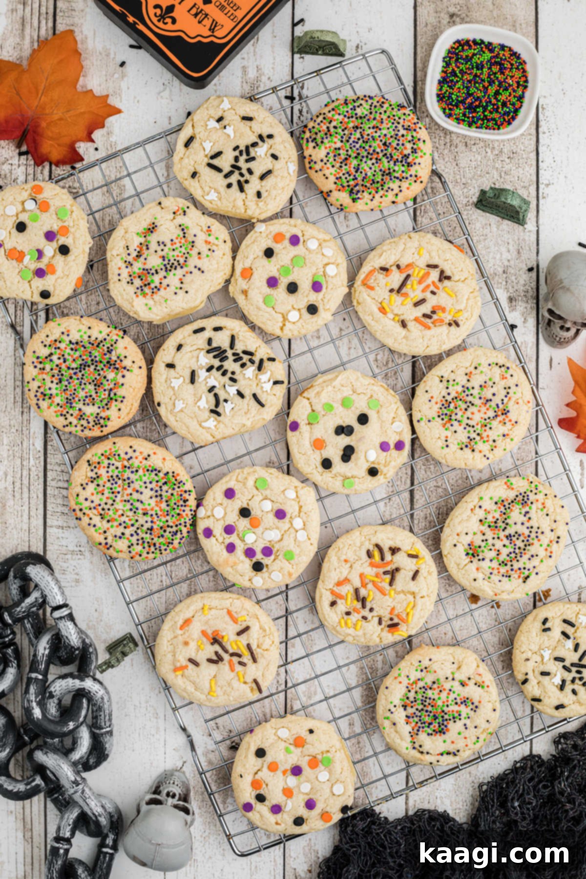 Spooktacular Sprinkled Cookies 2 Wire rack with freshly baked Halloween cake mix cookies decorated with colorful sprinkles.