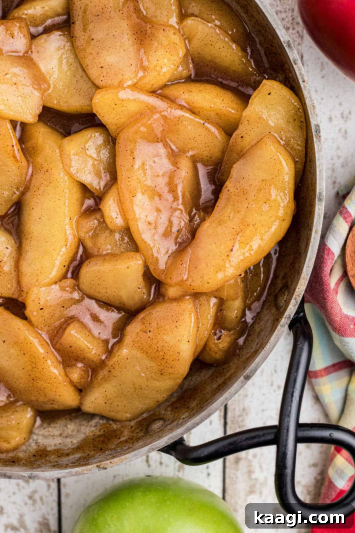 Overhead close up shot of a pan full of fried apples.