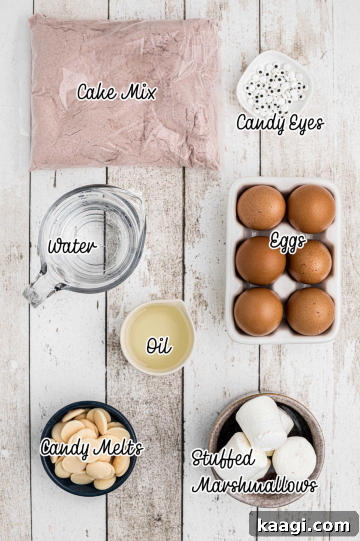 Fluffy Phantom Cupcakes 3 Ingredients needed to make ghost cupcakes, including cake mix, marshmallows, candy melts, and candy eyes.