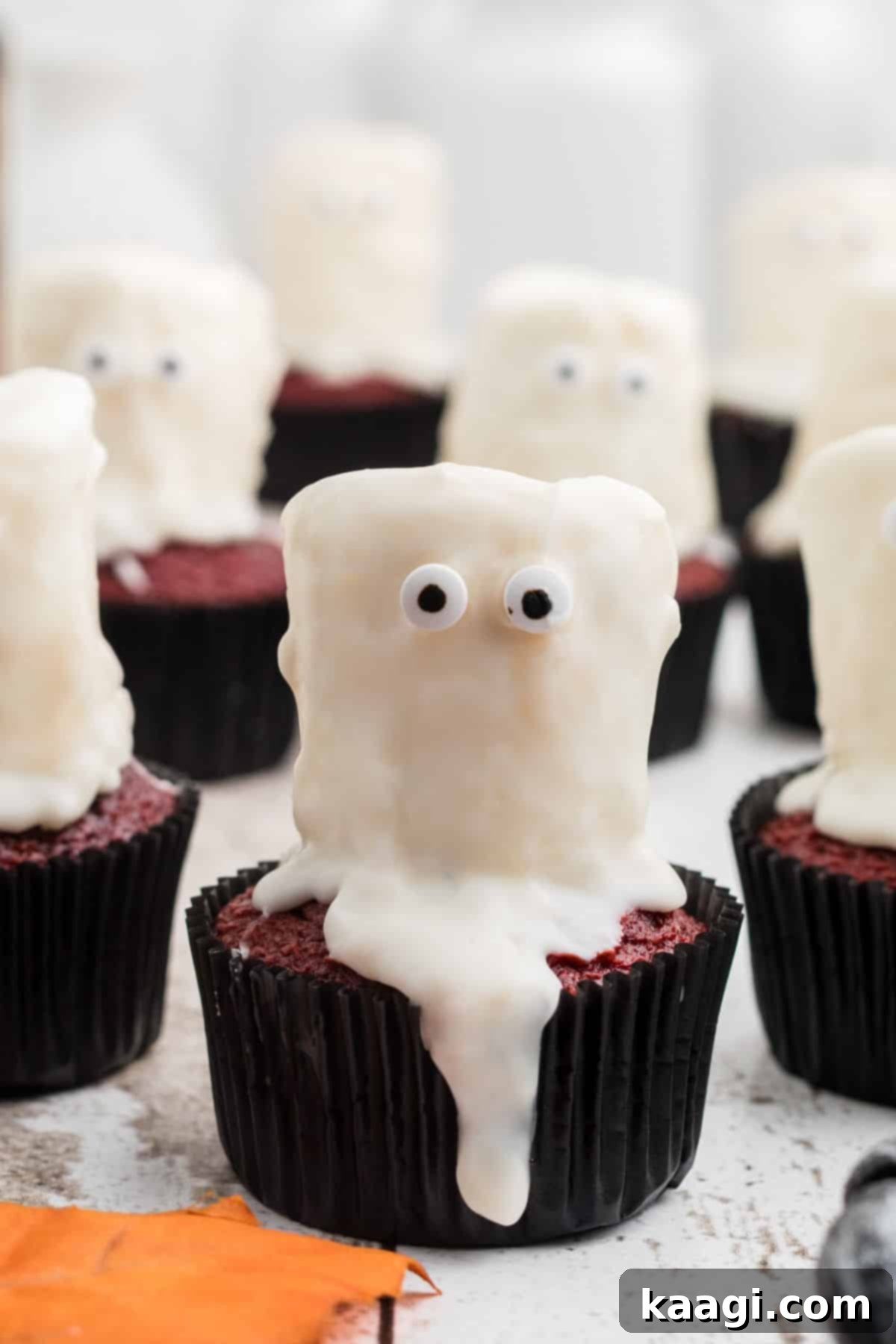 Fluffy Phantom Cupcakes 5 Close up of a ghost cupcake made from marshmallow, showcasing the chocolate inside.
