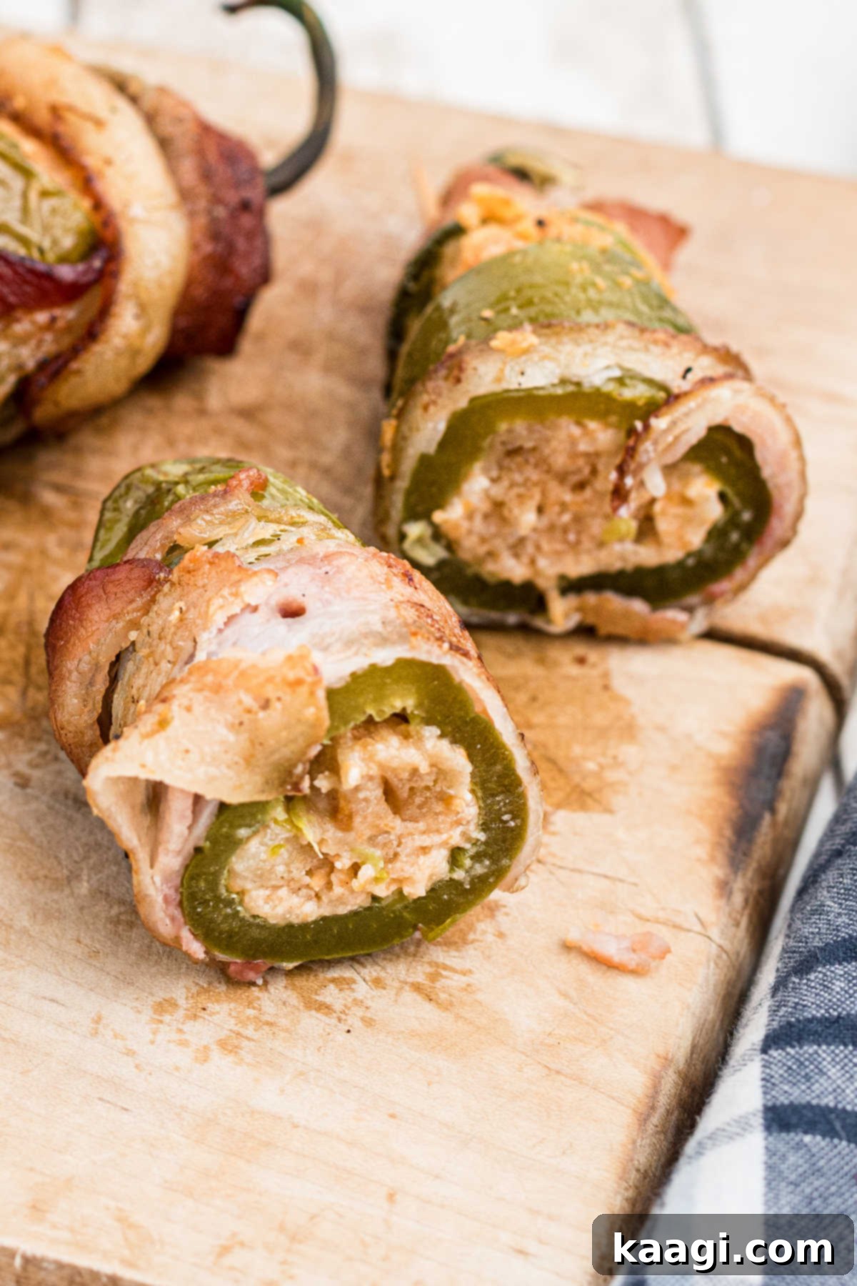 Fiery Smoked Jalapeno Bites 4 Close up of the inside of a smoked jalapeno popper, showing the creamy, cheesy filling.