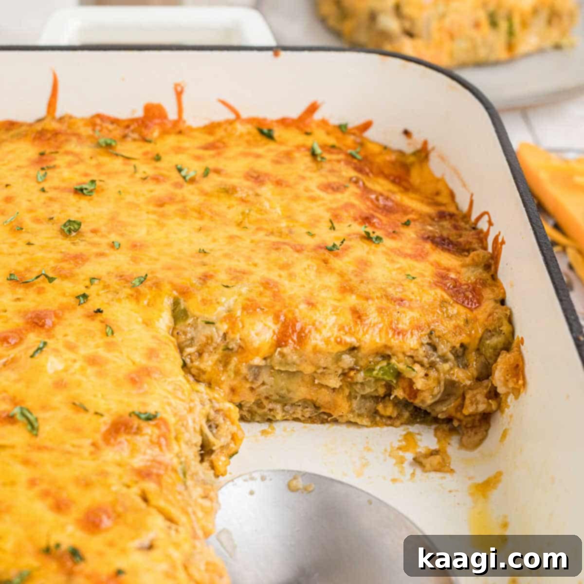 25 Must-Try Cajun Thanksgiving Side Dishes 17 Close up of an eggplant casserole in a baking dish, with a piece missing.