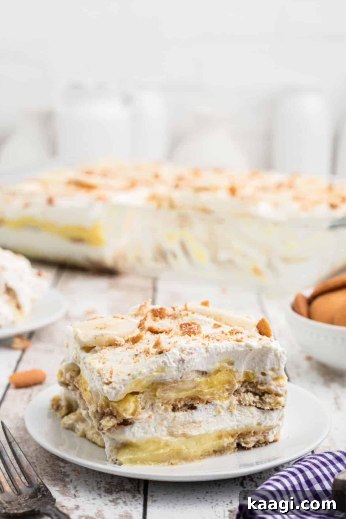 A dished up piece of no bake banana pudding, showing the distinct layers.