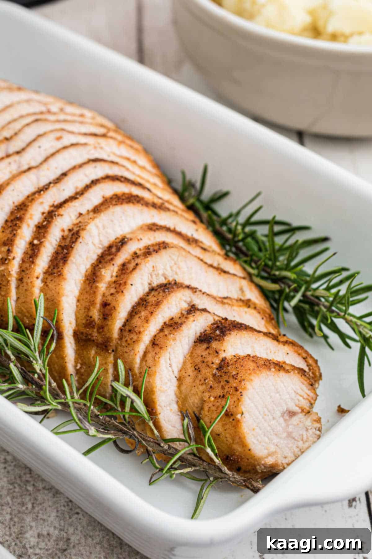 Cajun Spice Injection for Unforgettable Turkey Flavor 10 A turkey breast sliced and looking pretty in a baking dish.