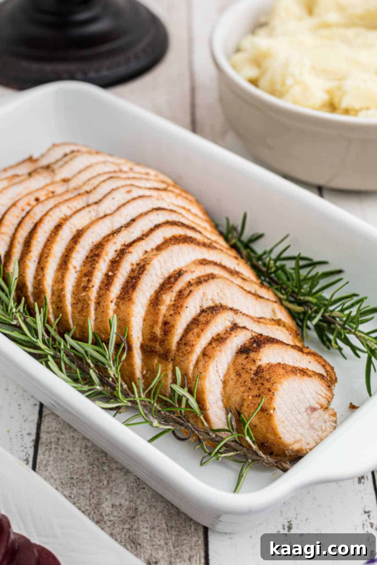 Turkey breast seasoned with cajun seasoning in a dish, ready for baking.