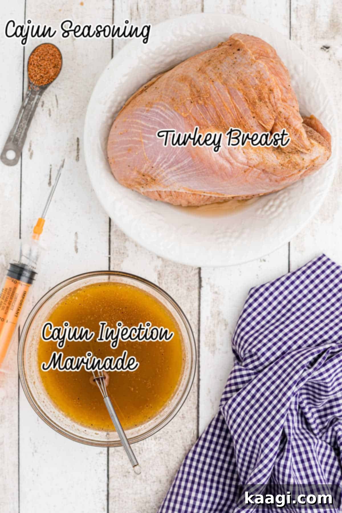 A collection of ingredients laid out, including a turkey breast, spices, and an injector.