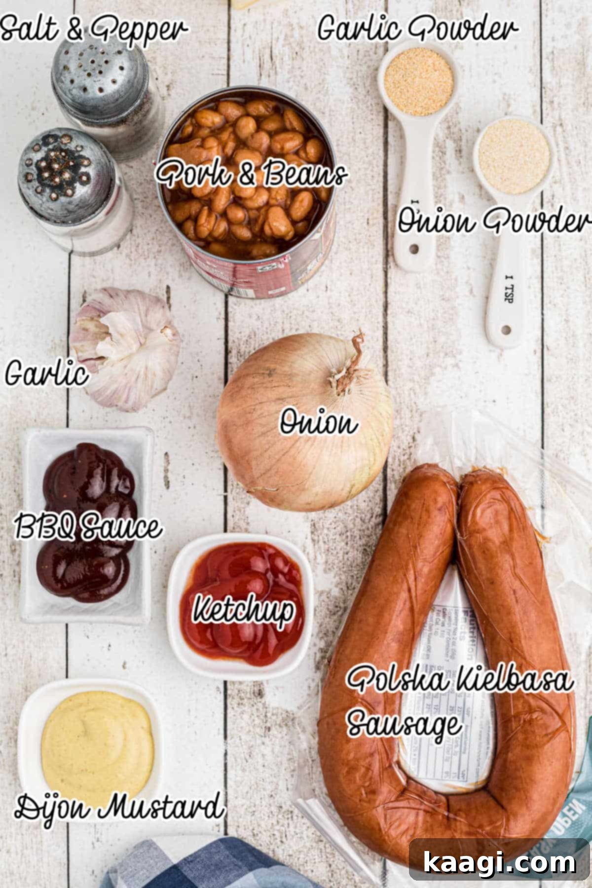 Smoky Kielbasa and Sweet Baked Beans Slow Cooker Delight 3 Ingredients needed to make a kielbasa and baked beans recipe, laid out on a surface.