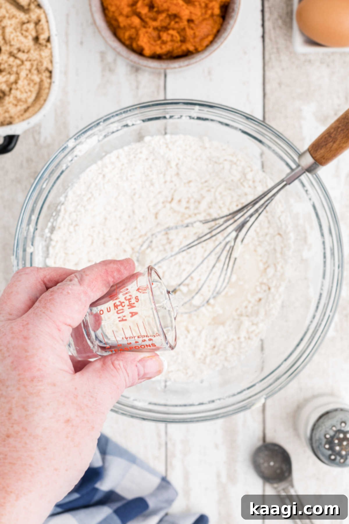 Water being added to a flour mixture.