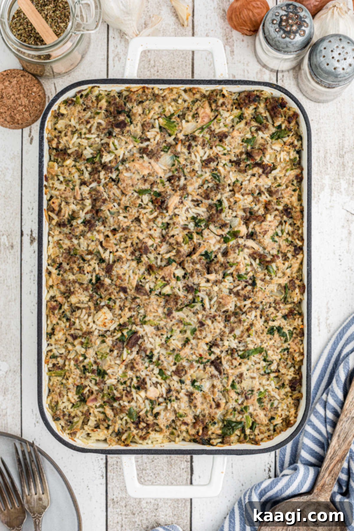 Overhead full shot of a dish of Cajun rice dressing, richly colored and inviting.