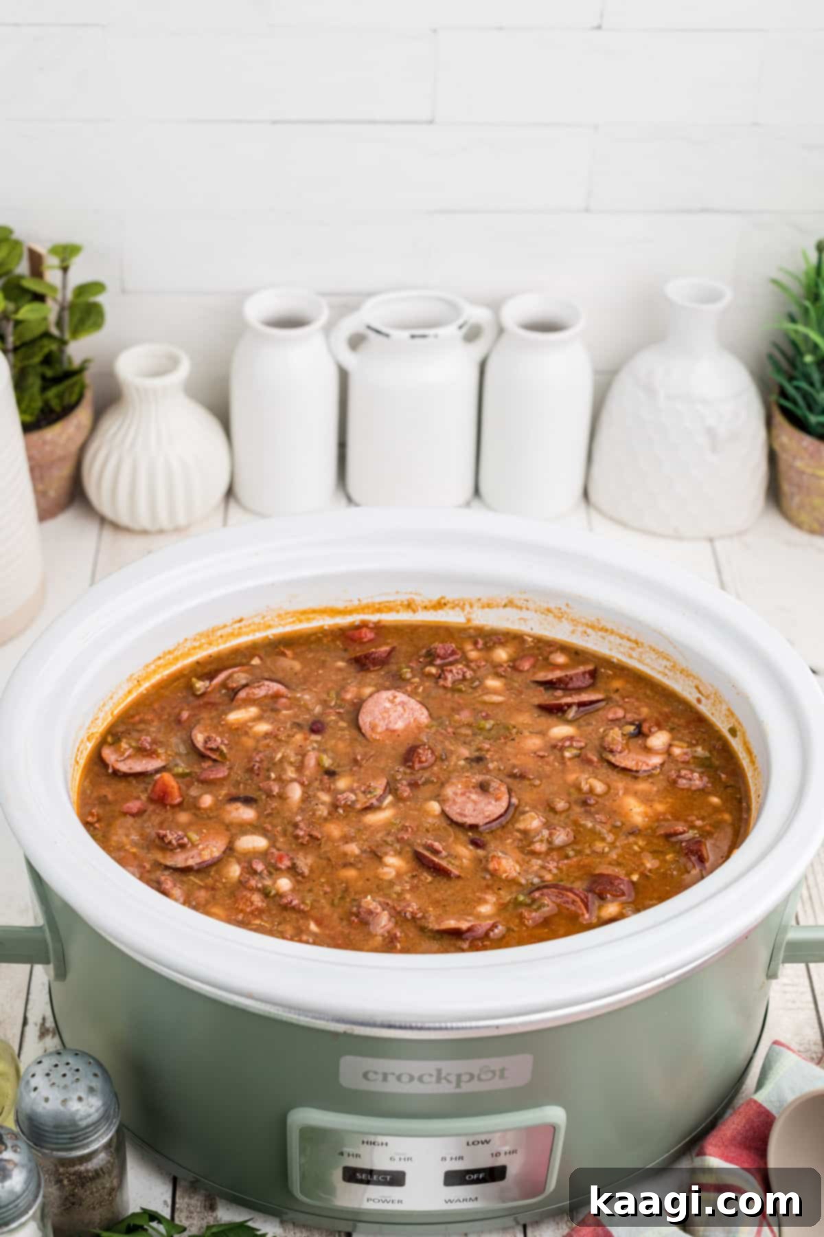 Front on view of a slow cooker Cajun 15 Bean soup, showing its hearty texture and deep colors, ready for serving.