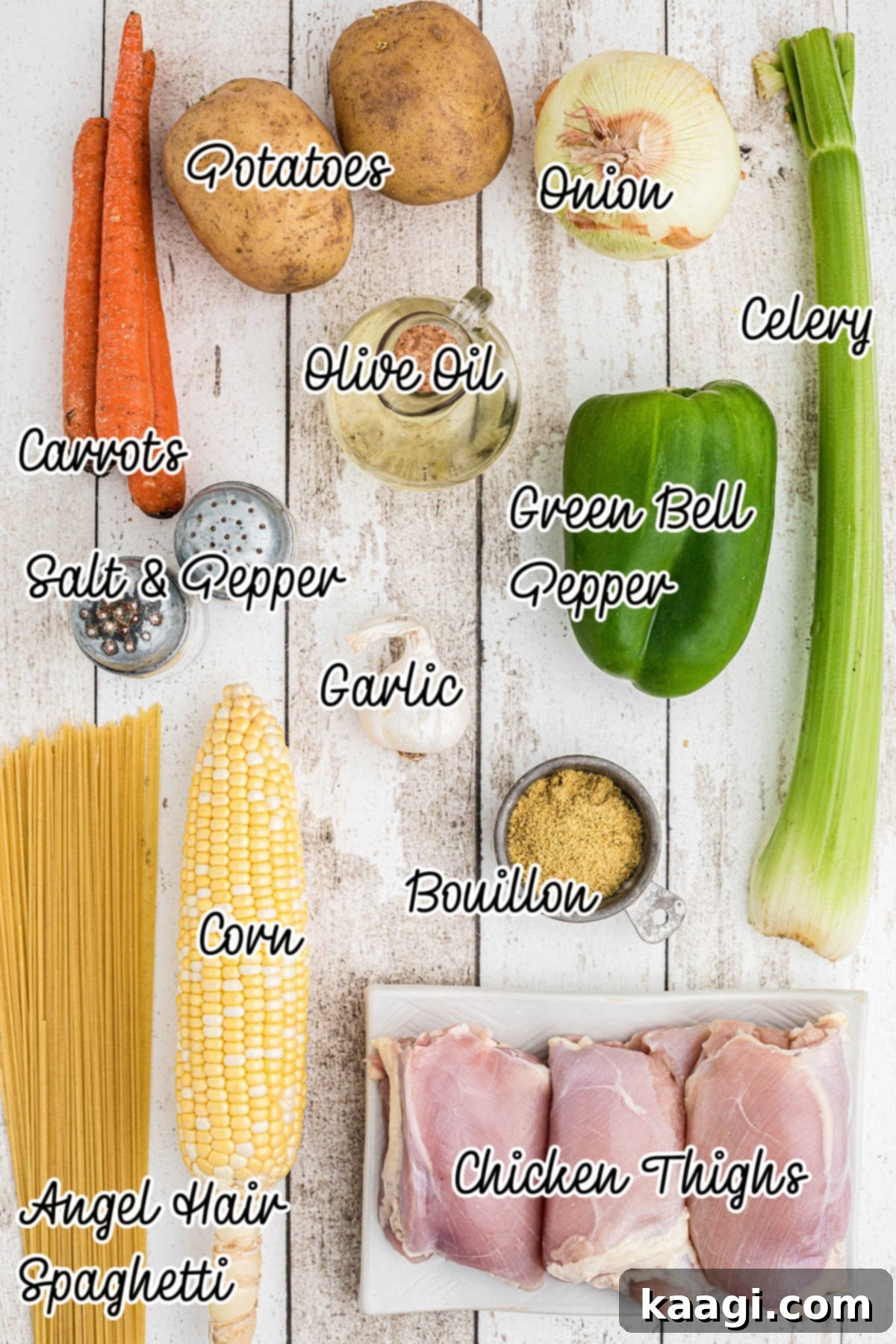 Ingredients all laid out what is needed to make a Cuban Chicken Soup recipe including fresh vegetables, chicken, and seasoning.