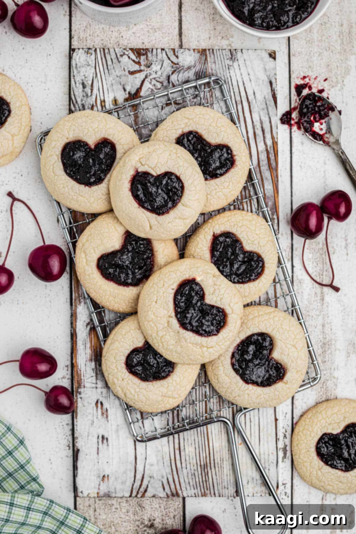 Viral Jam Heart Cookies 2 A beautiful overhead shot of freshly baked TikTok Jam Heart Cookies cooling on a wire rack, showcasing their perfect heart-shaped jam centers and golden edges.