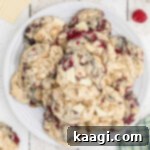 An overhead shot of a plate full of white chocolate raspberry cookies.