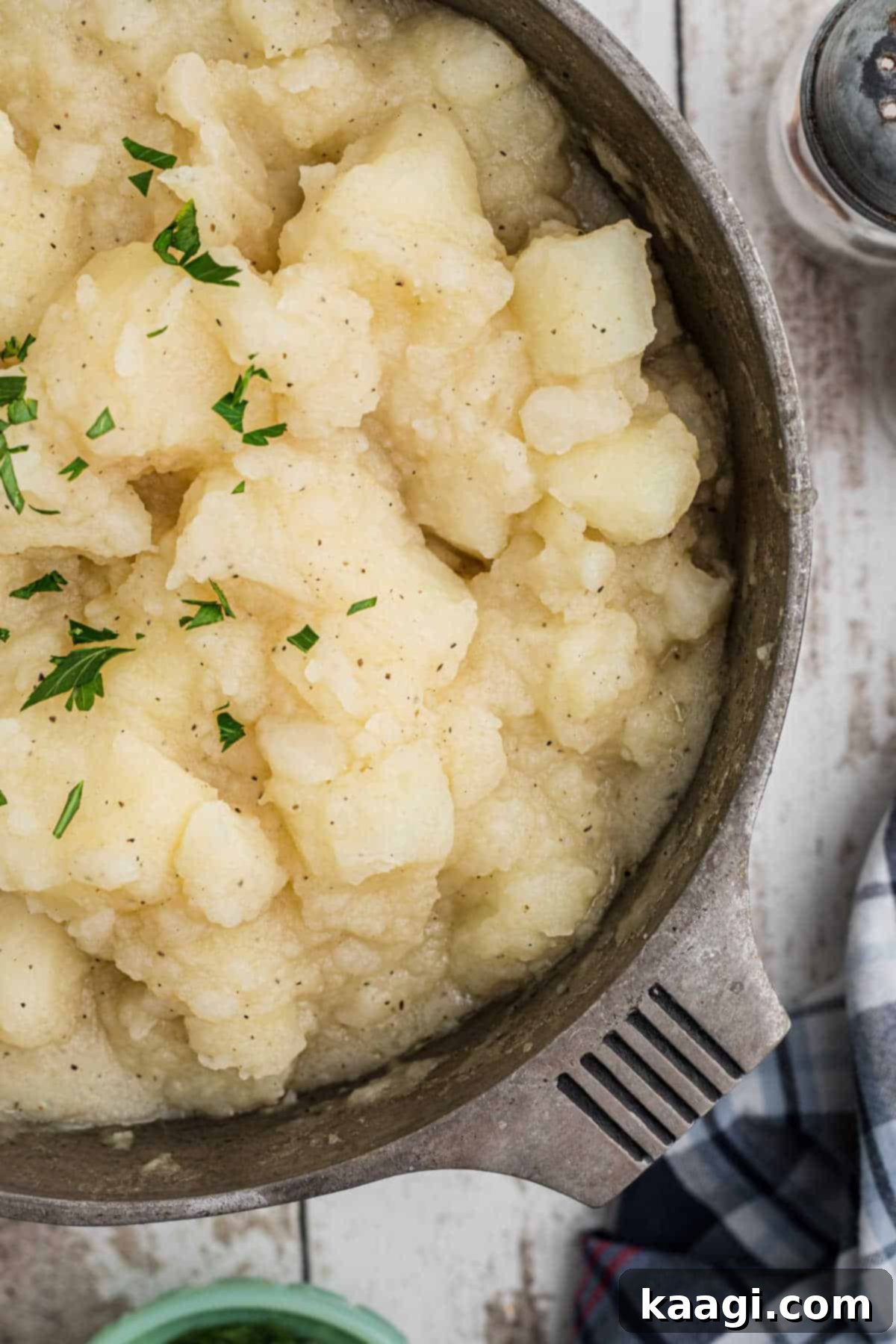 Comforting Potato Stew 2 Overhead close-up shot of a pot brimming with creamy Southern stewed potatoes, perfectly cooked and ready to serve.