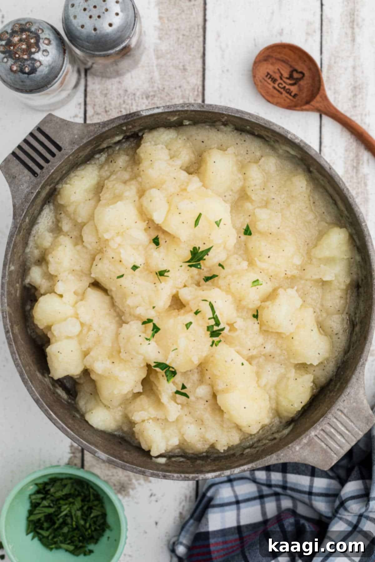 Comforting Potato Stew 4 Overhead shot of a pot of stewed potatoes, perfectly cooked and arranged for serving, showing their golden-brown edges.