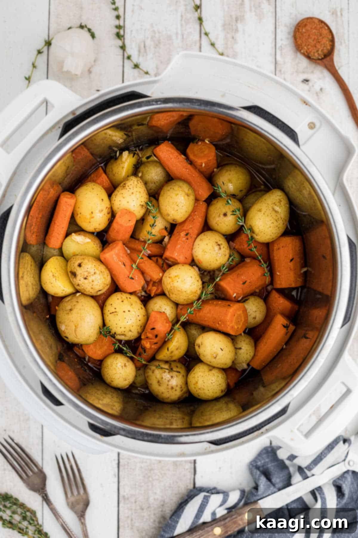 Overhead shot of an instant pot potatoes and carrots recipe, steaming hot and ready to serve.