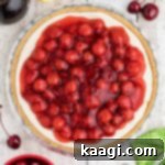 Close up overhead shot of a no bake cherry pie with a graham cracker crust.