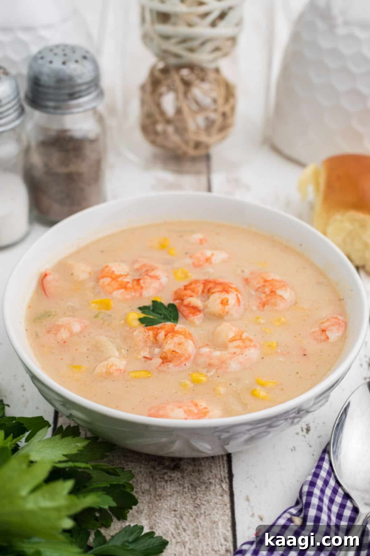 Creamy Shrimp and Sweet Corn Bisque 7 Side shot of a bowl of shrimp and corn bisque.