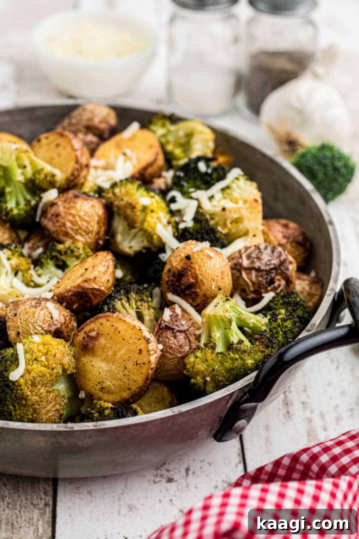 Crispy Roasted Potatoes and Broccoli 4 Side shot of a pan of roasted potatoes and broccoli, showcasing their beautiful textures and colors.