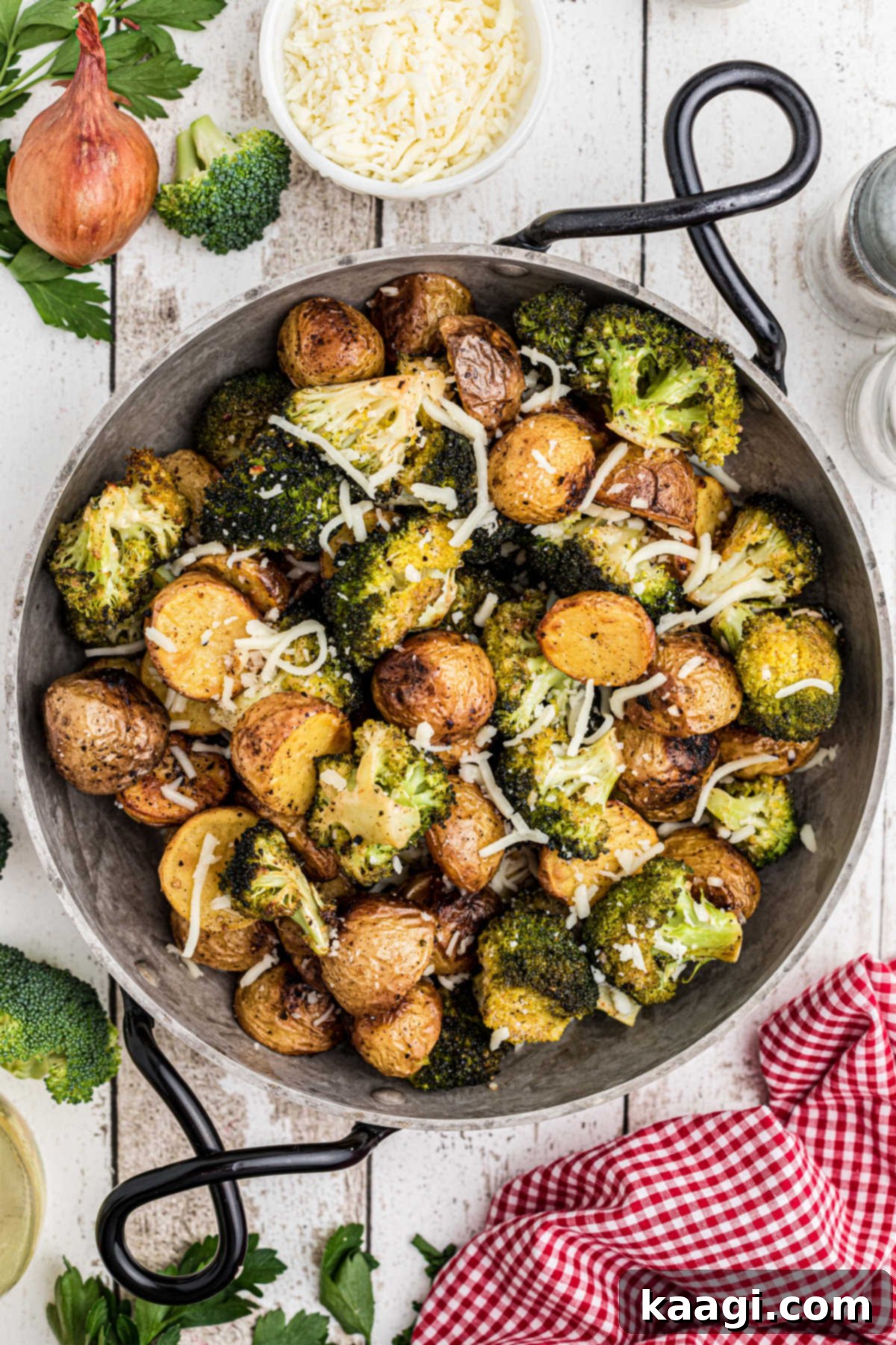 Crispy Roasted Potatoes and Broccoli 5 Overhead shot of a pan of roasted potatoes and broccoli, showing the steam rising off the freshly cooked vegetables.