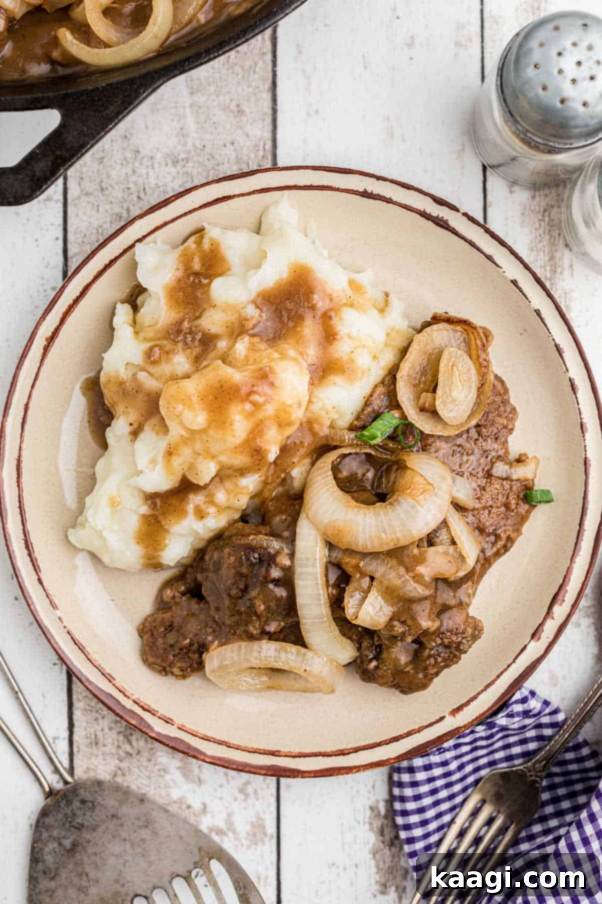 Dished out southern liver and onions with gravy.