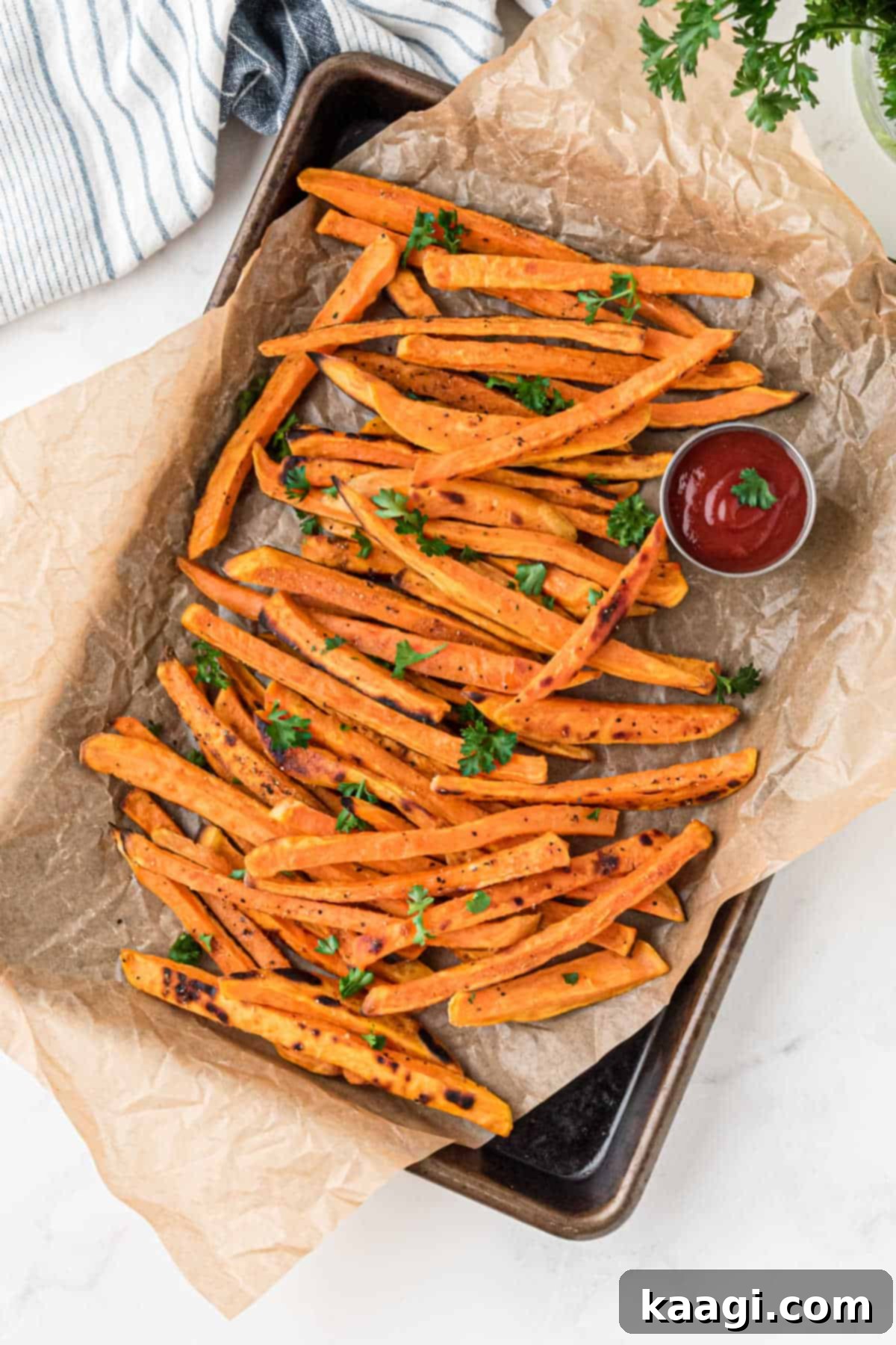 Sweet potato fries on a baking tray from overhead.
