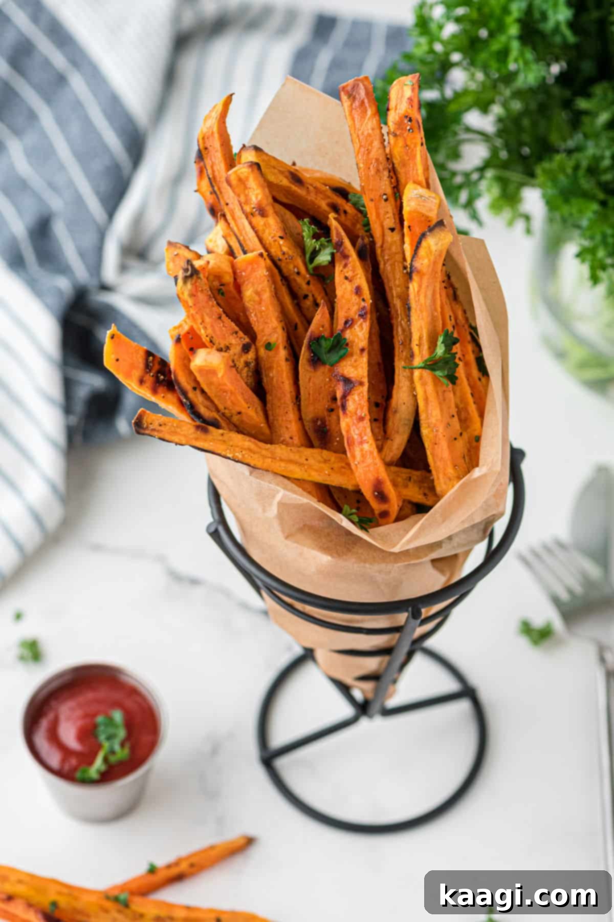 Crispy sweet potatoes in a cone holder.