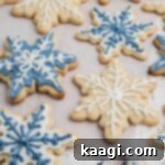 Close up shot of some snowflake cookies cropped square.