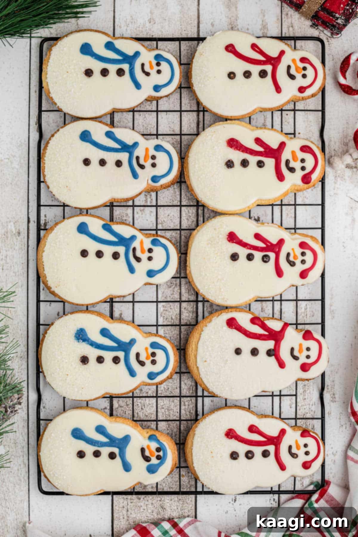 A cooling rack full of Starbucks snowman cookies.